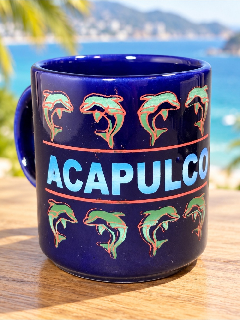Mug with 'ACAPULCO' and dolphins